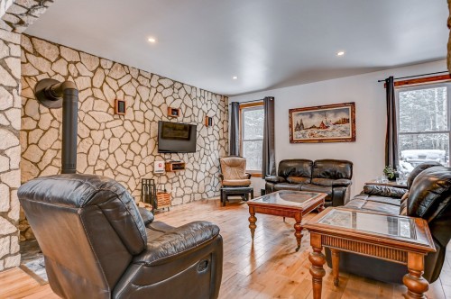 Salon - 561 Rue Pelletier, Saint-Colomban, QC - Indoor Photo Showing Living Room With Fireplace