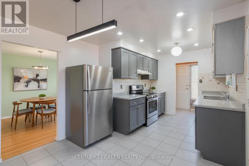 Virtually Staged Kitchen - 729 West 5Th Street, Hamilton, ON - Indoor Photo Showing Kitchen With Double Sink