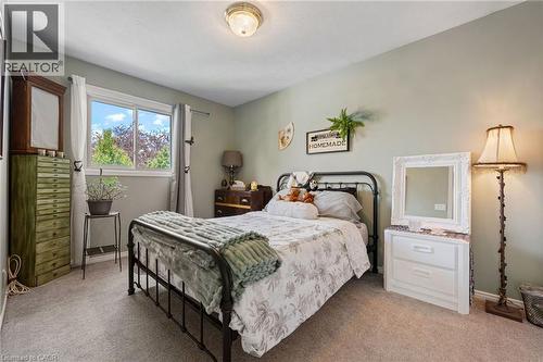 Wall-to-wall carpeting and neutral wall tones define this interior space - 2 Hampton Court, Port Dover, ON - Indoor Photo Showing Bedroom