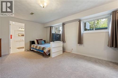 Carpeted room with multiple windows providing natural light - 2 Hampton Court, Port Dover, ON - Indoor Photo Showing Bedroom