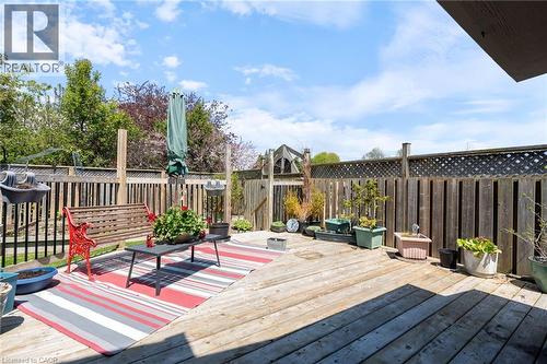 Expansive wood deck featuring a privacy fence, lattice details, and a partial outdoor gate - 2 Hampton Court, Port Dover, ON - Outdoor With Deck Patio Veranda