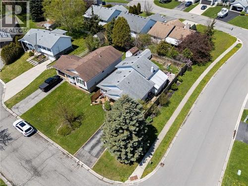 Residential property featuring a light-colored exterior, an attached garage, and a fenced backyard - 2 Hampton Court, Port Dover, ON - Outdoor With View