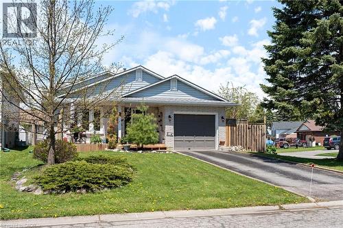 Ranch-style exterior featuring light-colored brick and horizontal siding - 2 Hampton Court, Port Dover, ON - Outdoor