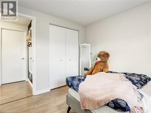 Room featuring wood-finish flooring, light-toned walls, and white trim - 209 Briarmeadow Drive, Kitchener, ON - Indoor Photo Showing Bedroom