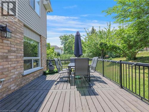 Spacious wood-finish deck with black metal railings - 209 Briarmeadow Drive, Kitchener, ON - Outdoor With Deck Patio Veranda With Exterior