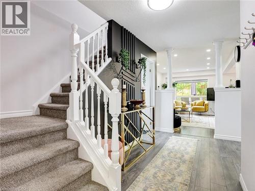 Carpeted staircase with white balusters - 209 Briarmeadow Drive, Kitchener, ON - Indoor Photo Showing Other Room
