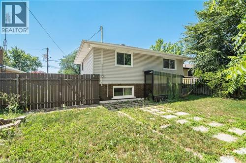 Spacious backyard with mature landscaping and established lawn area - 100 Mountain Avenue N, Hamilton, ON - Outdoor