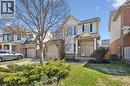 Two-story residential exterior featuring a brick and siding facade, a covered front porch, and a bay window - 5147 Ravine Crescent, Burlington, ON  - Outdoor 