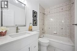 White vanity with an integrated rectangular sink, brushed nickel faucet, and a large mirrored medicine cabinet - 