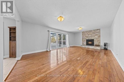 7089 Bush Drive, Ottawa, ON - Indoor Photo Showing Living Room With Fireplace