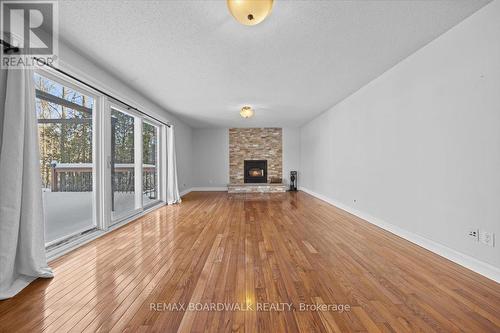 7089 Bush Drive, Ottawa, ON - Indoor Photo Showing Living Room With Fireplace