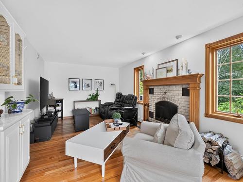 1864 Kings Road, Sydney River, NS - Indoor Photo Showing Living Room With Fireplace