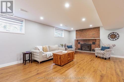 1041 Lebanon Drive, Innisfil, ON - Indoor Photo Showing Basement With Fireplace