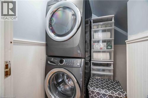 Stacked laundry washer/dryer unit also can be independent. - 99 Argyle Street N, Caledonia, ON - Indoor Photo Showing Laundry Room