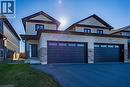 Contemporary exterior showcasing light-toned brick and vertical siding - 111 Amber Street, Waterford, ON  - Outdoor With Facade 
