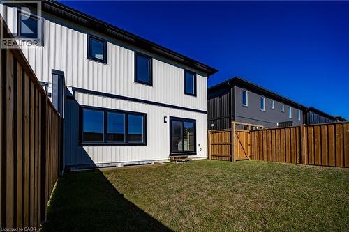 Expansive backyard with natural wood fencing and a gate - 111 Amber Street, Waterford, ON - Outdoor With Exterior