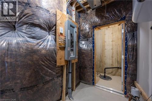 Utility space featuring insulation, an electrical panel, and a sump pump - 111 Amber Street, Waterford, ON - Indoor Photo Showing Basement