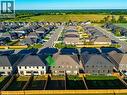 Contemporary residential development featuring a structured street layout, uniform housing designs, and distinct backyard spaces - 115 Amber Street, Waterford, ON  - Outdoor With View 