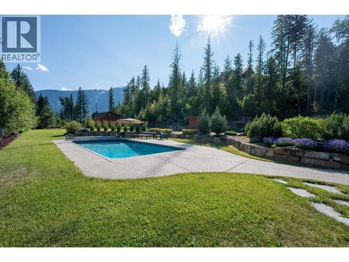 1917 Mt Mcpherson Drive, Revelstoke, BC - Outdoor With In Ground Pool With Backyard
