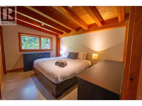 Primary bdrm in owner/caretaker suite - 1917 Mt Mcpherson Drive, Revelstoke, BC - Indoor Photo Showing Bedroom