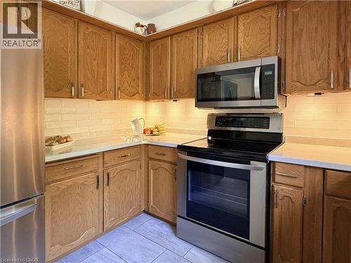 Stainless appliances. - 7 Mann Avenue, Simcoe, ON - Indoor Photo Showing Kitchen