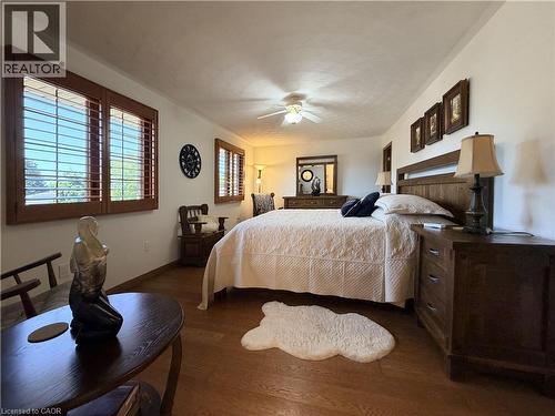 Hardwood flooring complementing white walls. - 7 Mann Avenue, Simcoe, ON - Indoor Photo Showing Bedroom