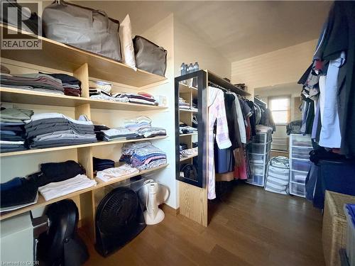 Large walk in closet in the primary bedroom. - 7 Mann Avenue, Simcoe, ON - Indoor With Storage