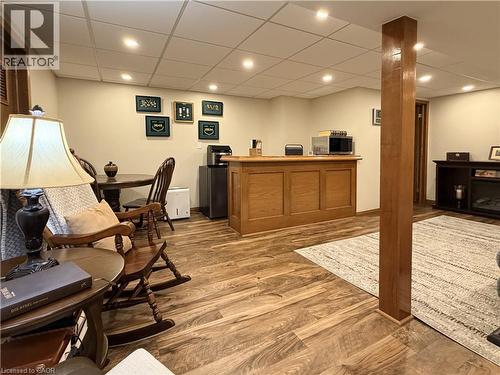 Basement games room with bar, new drop ceiling panels and pot lights. - 7 Mann Avenue, Simcoe, ON - Indoor