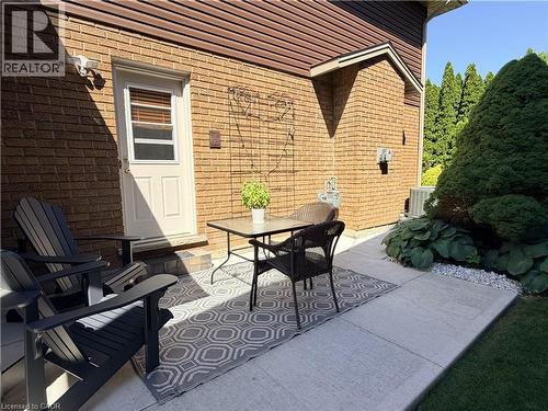 New Concrete patio (2020) and walkway to back yard. - 7 Mann Avenue, Simcoe, ON - Outdoor With Deck Patio Veranda With Exterior