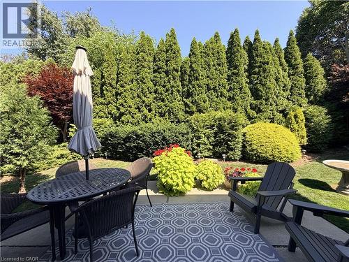 Located in a sought-after family neighbourhood within walking distance to schools and just minutes from shopping and amenities, this exceptional home offers the space, style, and peace of mind that on - 7 Mann Avenue, Simcoe, ON - Outdoor With Deck Patio Veranda