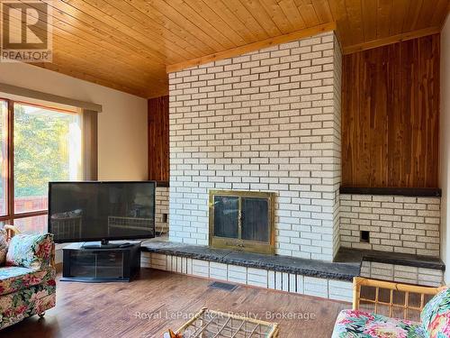 With floor to ceiling fireplace. - 2 William Street, Northern Bruce Peninsula, ON - Indoor Photo Showing Living Room With Fireplace