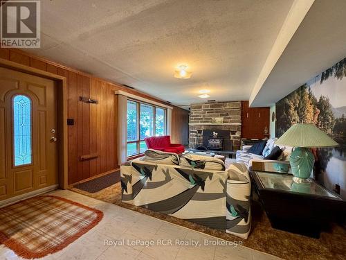 Family rooms with fireplace & water view. - 2 William Street, Northern Bruce Peninsula, ON - Indoor Photo Showing Other Room