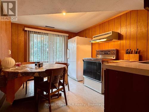 Lower level kitchenette with water view. - 2 William Street, Northern Bruce Peninsula, ON - Indoor Photo Showing Kitchen