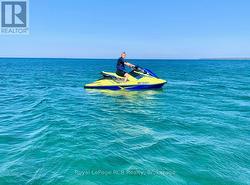 Keep water craft at a shoreline or marina dock. - 