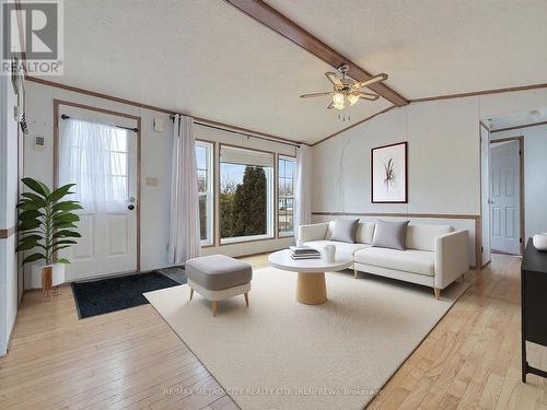 Photo has been virtually staged - 34 Sunset Lane, Horton, ON - Indoor Photo Showing Living Room
