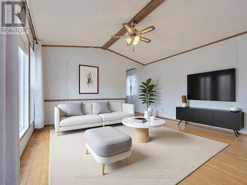 Photo has been virtually staged - 34 Sunset Lane, Horton, ON - Indoor Photo Showing Living Room