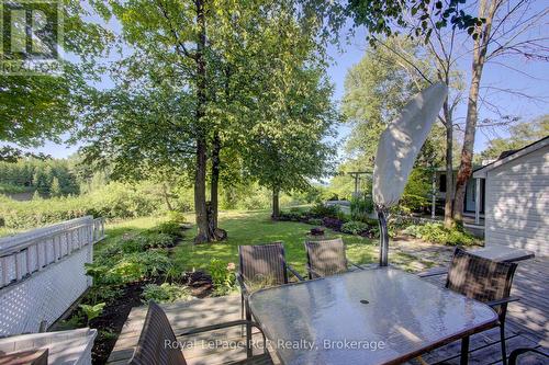 Large backyard with beautiful flowerbeds - 3 Maple St - 79681 Bluewater Hwy 21, Central Huron (Goderich), ON - Outdoor With Deck Patio Veranda
