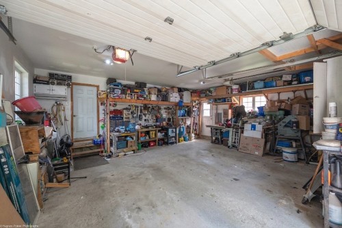 Garage - 112 Rue Jacques, Saint-Colomban, QC - Indoor Photo Showing Garage