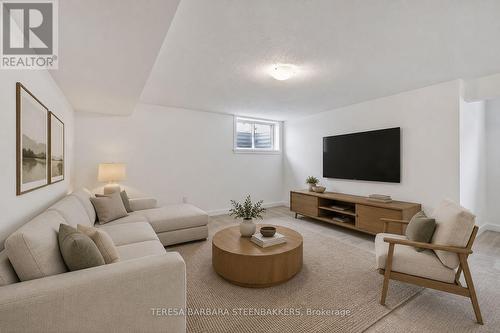 Virtually staged finished basement Family room - 1164 Bronze Avenue, Clarence-Rockland, ON - Indoor Photo Showing Living Room