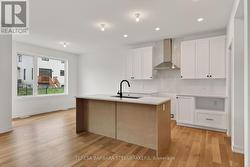 Center island with sink and bar style seating - 