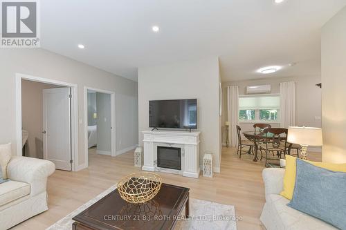 Unit 2 Living - Dining Room - 1650 Trader Cowan Road, Severn, ON - Indoor Photo Showing Living Room With Fireplace