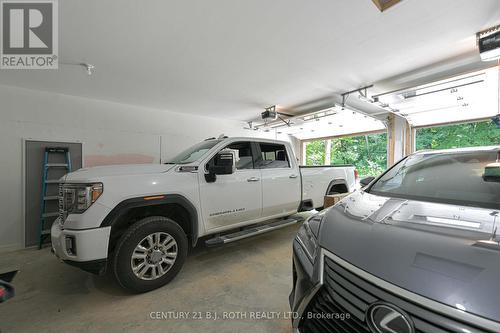 Garage - Inside entrances to both units - 1650 Trader Cowan Road, Severn, ON - Indoor Photo Showing Garage