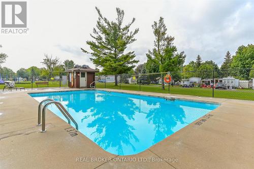 445 Pine Pass, Centre Wellington, ON - Outdoor With In Ground Pool With Backyard