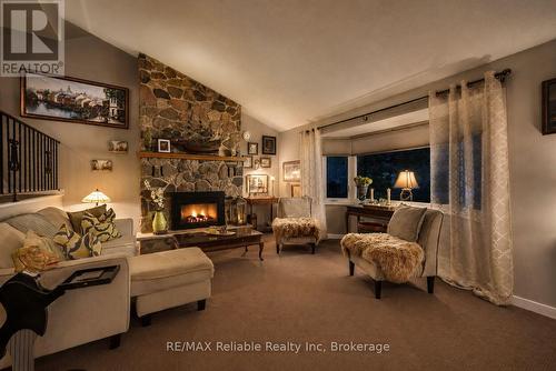 Virtual night time photo - 45 Main Street S, Bluewater (Bayfield), ON - Indoor Photo Showing Living Room With Fireplace
