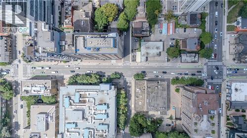 Aerial perspective showcasing an urban environment with multi-lane roads, pedestrian crosswalks, and mature tree-lined streetscapes - 96 Gerrard St E, Toronto, ON 