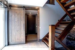 MAIN FLOOR ENTRY AND STAIRCASE - 