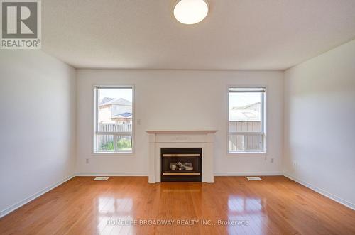 16 Raymond Bartlett Avenue, Markham, ON - Indoor Photo Showing Living Room With Fireplace