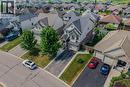 Two-story residence featuring a combination of brick and siding, a two-car garage, and a paved driveway - 174 Woodway Trail, Simcoe, ON  - Outdoor With View 