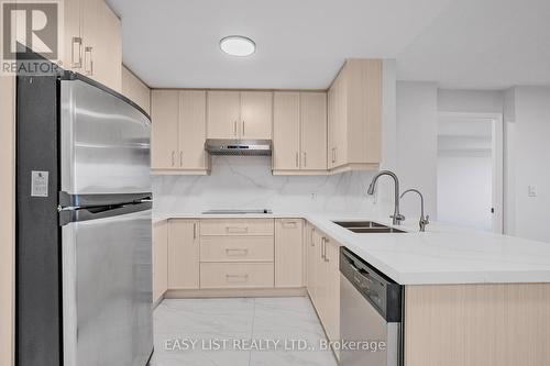 319 - 2020 Mcnicoll Avenue, Toronto, ON - Indoor Photo Showing Kitchen With Stainless Steel Kitchen With Double Sink