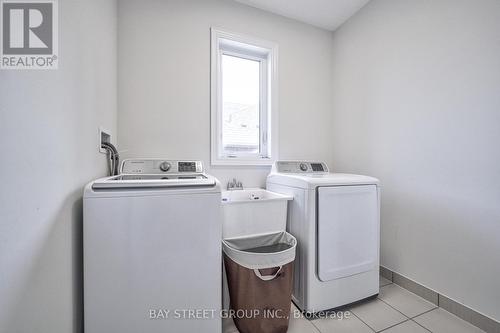 23 Trail Boulevard, Springwater, ON - Indoor Photo Showing Laundry Room